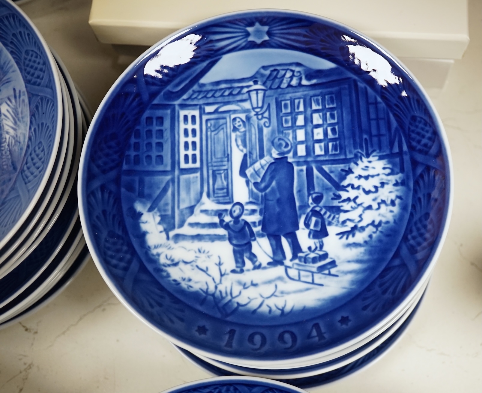 A large collection of Royal Copenhagen Christmas plates to include In the old farmyard, 1969 and In the desert 1972, with three boxes, each 18cm in diameter. Condition - good